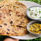 Aloo Achari Paratha With Curd, Chutney And Achaar