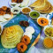 Jain Rava Masala Dosa, 1 Pc Idli, 2Pc Vadas With Sambar And Chutneys.