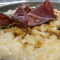 Risotto In Fonduta Di Pecorino E Fondo Bruno Con Carpaccio Di Manzo Marinato